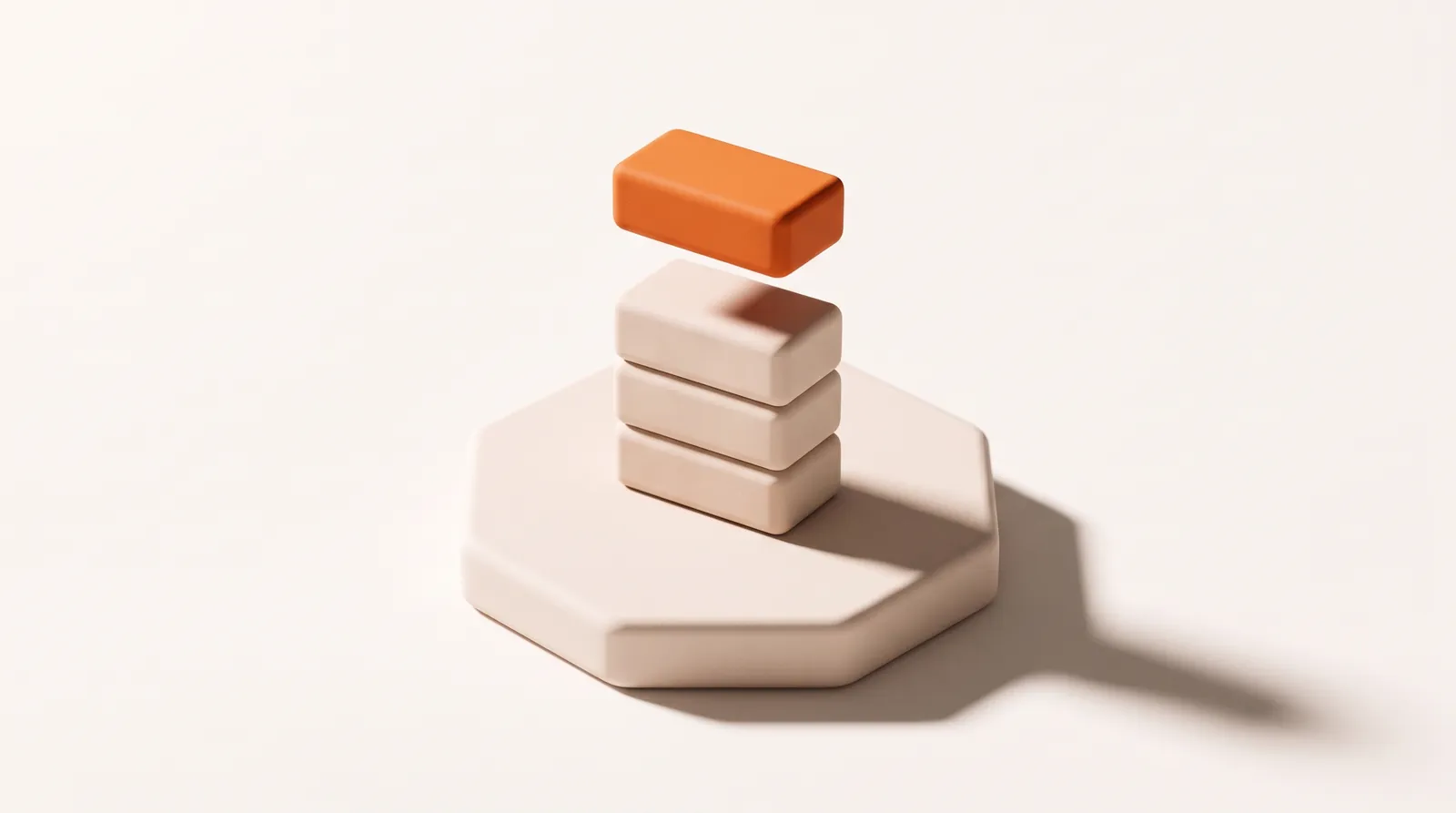 Building blocks with an orange block being placed on top